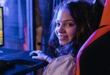 A gamer woman smiling at the camera