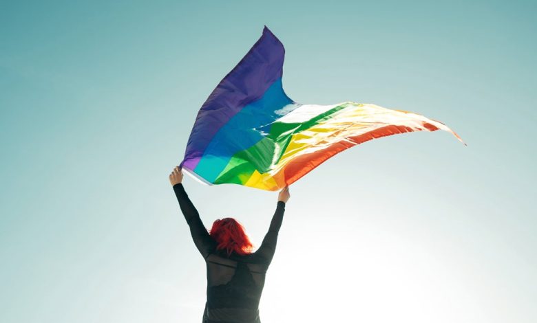 Read This If You're Asking Yourself ‘Am I Queer Enough?’ 1 gay pride flag wave 1200x628 facebook