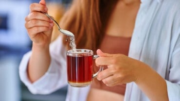 Putting sugar in tea Putting sugar in tea