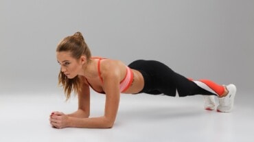 A woman doing planks for abs A woman doing planks for abs