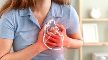 A woman pointing at her heart A woman pointing at her heart