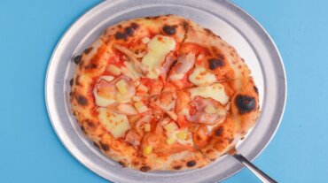 A complete pizza with cheese A complete pizza with cheese